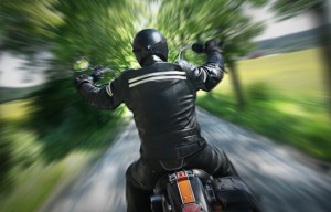 Motorcycle rider wearing protective motorcycle clothing