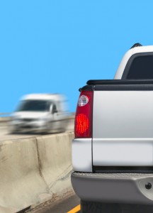 White pickup with truck stopped on freeway in left lane near concrete - Tonneau covers